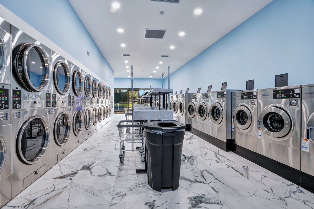 Bright rows of commercial washers inside Sac O Suds in Daytona Beach